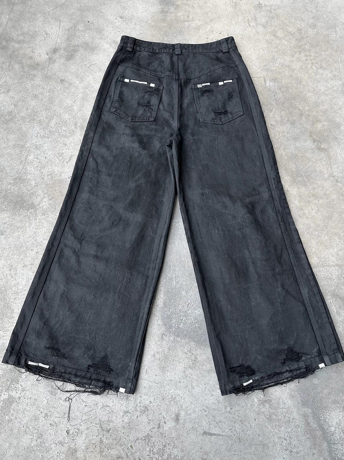 WIDE LEG DESTROYED WAXED JEANS