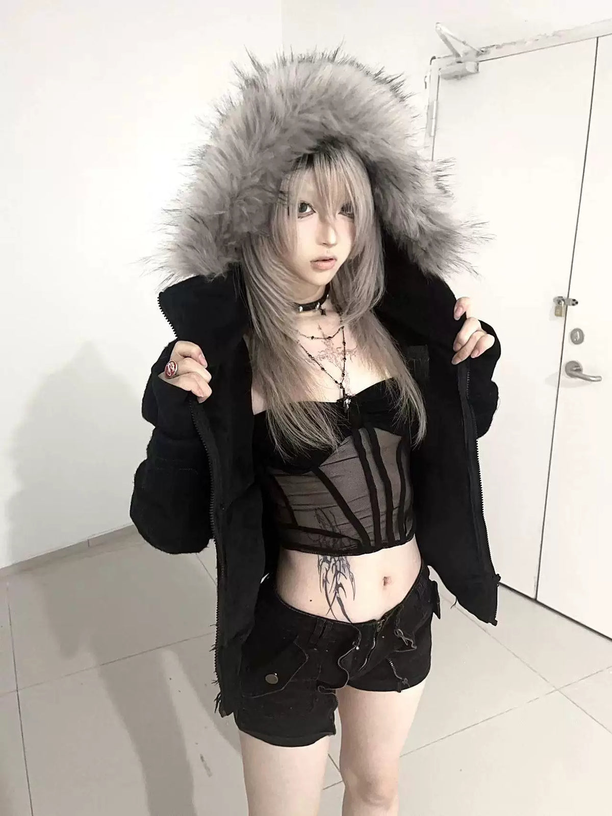 FUR HOODED SWEATSHIRT WITH TASSELS