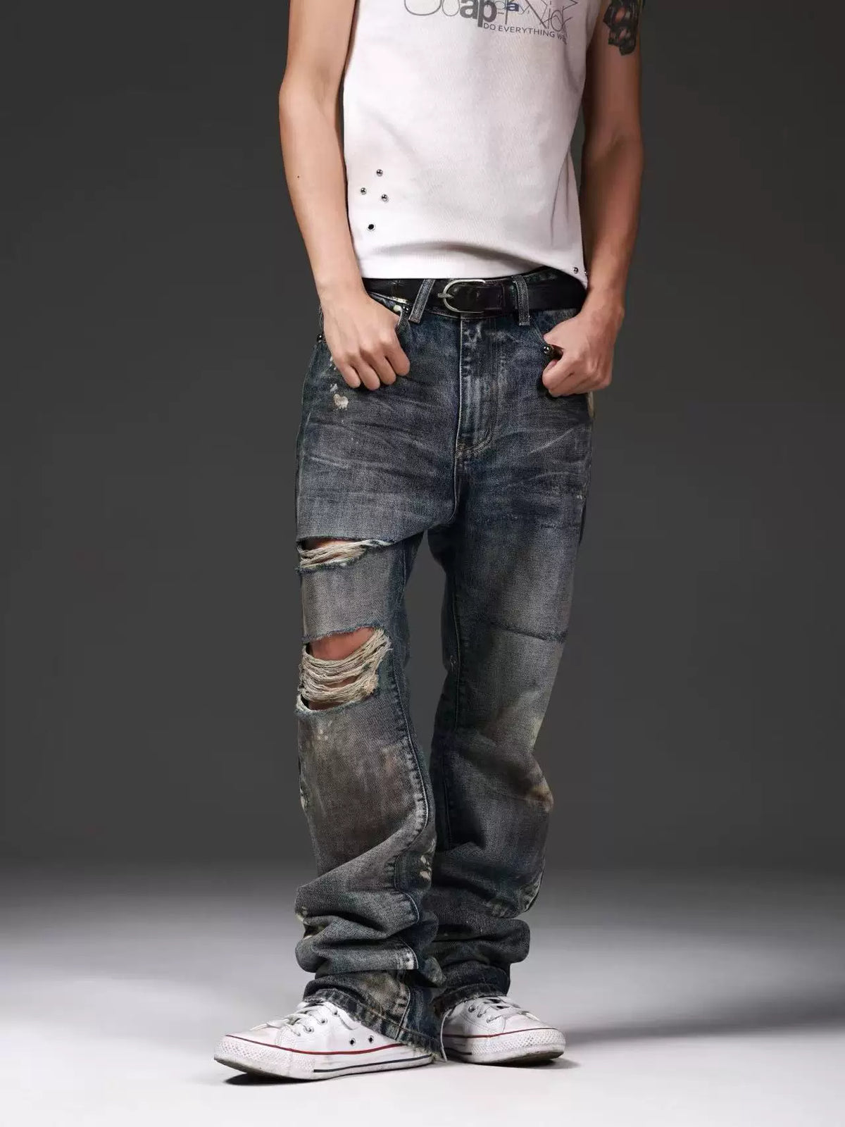 DISTRESSED DENIM JEANS WITH INK SPLATTER