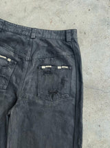 WIDE LEG DESTROYED WAXED JEANS