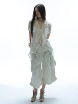 IRREGULAR HEM RUFFLE SHIRT