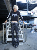 DISTRESSED RESIN COATED JEANS