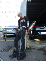 DISTRESSED RESIN COATED JEANS