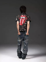 DISTRESSED DENIM JEANS WITH INK SPLATTER