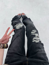 LOW RISE RIPPED JEANS WITH WHISKERS
