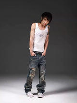 DISTRESSED DENIM JEANS WITH INK SPLATTER