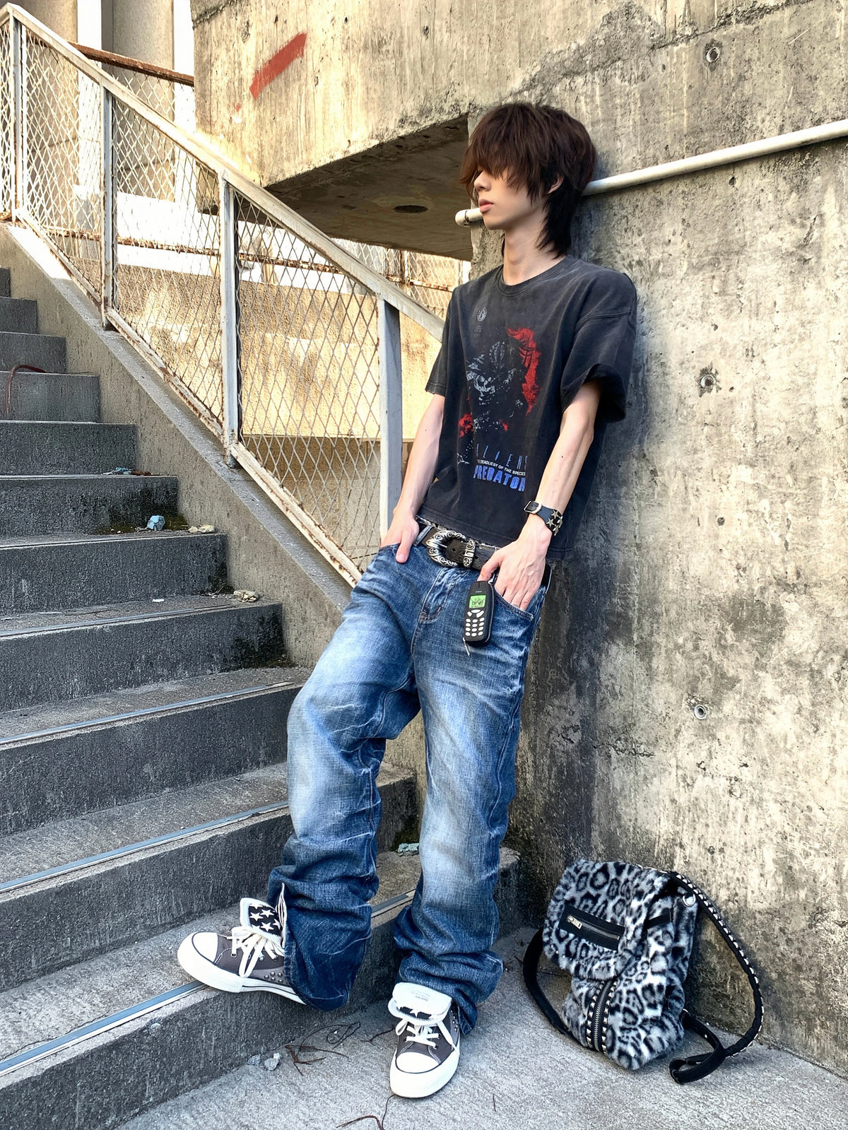 DISTRESSED PLEATED STRAIGHT-LEG JEANS
