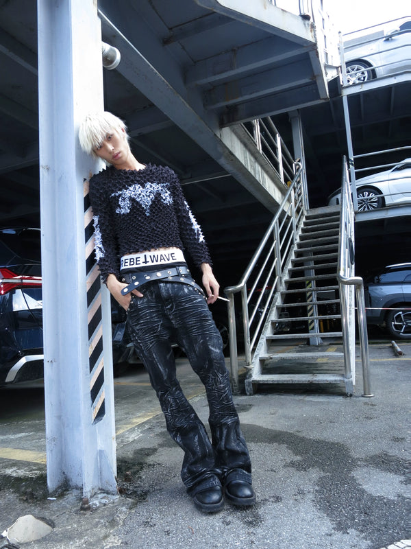 DISTRESSED RESIN COATED JEANS