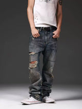 DISTRESSED DENIM JEANS WITH INK SPLATTER
