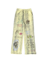 DISTRESSED YELLOW SWEATPANTS